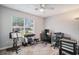 Bright bedroom featuring a ceiling fan, large window, and a dedicated workspace at 2768 Temperance Dr., Myrtle Beach, SC 29577