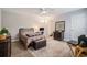 Comfortable bedroom with ceiling fan, neutral walls, wood-look floors, and ample natural light at 2768 Temperance Dr., Myrtle Beach, SC 29577