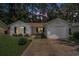 Exterior view of a home with a single-car garage, black shutters, and a small front yard at 2768 Temperance Dr., Myrtle Beach, SC 29577