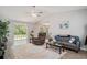 Spacious living room with high ceilings, neutral walls, stylish furnishings, and sliding glass doors leading to the backyard at 2768 Temperance Dr., Myrtle Beach, SC 29577