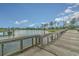 Scenic view from a wooden pier overlooking a tranquil lake and community at 2768 Temperance Dr., Myrtle Beach, SC 29577
