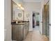 Bathroom with a large vanity, framed mirror, and a glass-enclosed shower at 290 Dornoch Dr., Pawleys Island, SC 29585
