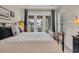 Bedroom with French doors leading to the backyard, allowing for ample natural light at 290 Dornoch Dr., Pawleys Island, SC 29585
