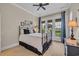 Bedroom with French doors leading to the backyard, allowing for ample natural light at 290 Dornoch Dr., Pawleys Island, SC 29585