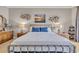 The main bedroom has two bedside tables, two lamps, and a decorative metal frame bed at 290 Dornoch Dr., Pawleys Island, SC 29585