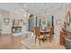 Dining area with stylish furnishings and hardwood flooring adjacent to the grand foyer at 290 Dornoch Dr., Pawleys Island, SC 29585