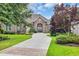 Attractive brick home with lush landscaping, long drive and a double-door entry at 290 Dornoch Dr., Pawleys Island, SC 29585