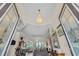 Grand foyer featuring soaring ceilings, elegant lighting, and an open floor plan at 290 Dornoch Dr., Pawleys Island, SC 29585