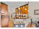 Eat-in kitchen featuring a peninsula bar with granite countertop, pendant lighting, and seating for two at 290 Dornoch Dr., Pawleys Island, SC 29585