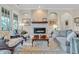 Comfortable living room with fireplace, hardwood floors, and ample natural light at 290 Dornoch Dr., Pawleys Island, SC 29585