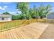 Large wooden deck perfect for outdoor gatherings with views of the lush backyard at 3001 Wiley Dr., North Myrtle Beach, SC 29582