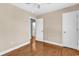 Inviting bedroom with hardwood floors and closet leading into the ensuite bathroom at 3001 Wiley Dr., North Myrtle Beach, SC 29582