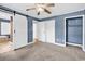 Spacious bedroom with barn door, ceiling fan, walk-in closet, and blue painted accent wall at 3001 Wiley Dr., North Myrtle Beach, SC 29582