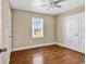 Cozy bedroom with hardwood floors, a ceiling fan, and a double-door closet at 3001 Wiley Dr., North Myrtle Beach, SC 29582