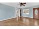 Spacious living room with hardwood floors, a large window, and an elegant wooden door at 3001 Wiley Dr., North Myrtle Beach, SC 29582