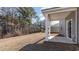 Covered patio with large yard surrounded by tall trees for privacy at 373 Acosta Circle, Conway, SC 29527