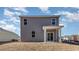 Rear exterior view of a two-story house with a covered patio and slider door at 373 Acosta Circle, Conway, SC 29527