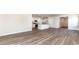 Bright, open-concept living area with wood-look floors and a modern kitchen, perfect for entertaining at 373 Acosta Circle, Conway, SC 29527