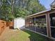 View of screened in patio, storage shed, and fenced yard at 3805 Mayfield Dr., Conway, SC 29526