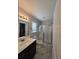 Modern bathroom with a glass-enclosed shower, sleek vanity, and ample natural light at 3805 Mayfield Dr., Conway, SC 29526
