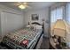 Cozy bedroom featuring a bed with a quilt, closet, and charming details for a relaxing retreat at 3805 Mayfield Dr., Conway, SC 29526