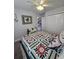 Comfortable bedroom featuring a bed with a floral pattern, closet, and inviting decor at 3805 Mayfield Dr., Conway, SC 29526