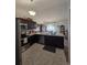 Bright kitchen features stainless steel appliances, and an island with a sink and countertop space at 3805 Mayfield Dr., Conway, SC 29526
