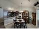 Open floor plan featuring a kitchen area with dark cabinets, granite countertops, and stainless steel appliances at 3805 Mayfield Dr., Conway, SC 29526