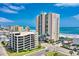 An aerial shot overlooking ocean, buildings, and beach with beach goers at 3805 S Ocean Blvd. # 503, North Myrtle Beach, SC 29582