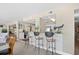 Cozy bar area with seating, a view of the kitchen, and bright natural light at 3805 S Ocean Blvd. # 503, North Myrtle Beach, SC 29582