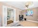 Home bedroom with a ceiling fan, tile floors, and connecting office space at 3805 S Ocean Blvd. # 503, North Myrtle Beach, SC 29582