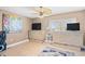 Bedroom featuring tile floors, ceiling fan, and two light wooden dressers at 3805 S Ocean Blvd. # 503, North Myrtle Beach, SC 29582