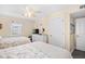 Comfortable bedroom with two twin beds, a ceiling fan, and white painted furnishings at 3805 S Ocean Blvd. # 503, North Myrtle Beach, SC 29582