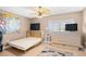 Cozy bedroom features a ceiling fan, murphy bed, and flat screen televisions at 3805 S Ocean Blvd. # 503, North Myrtle Beach, SC 29582
