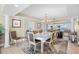 Stylish dining room featuring a glass-top table, decorative rug, and scenic ocean views at 3805 S Ocean Blvd. # 503, North Myrtle Beach, SC 29582