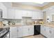 Kitchen boasts granite countertops, sleek white cabinetry, and modern stainless appliances at 3805 S Ocean Blvd. # 503, North Myrtle Beach, SC 29582