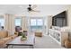 Bright living room boasting ocean views, a ceiling fan, and modern entertainment center at 3805 S Ocean Blvd. # 503, North Myrtle Beach, SC 29582