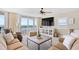 Cozy living room with ocean view balcony, comfortable furniture, and a decorative cabinet at 3805 S Ocean Blvd. # 503, North Myrtle Beach, SC 29582