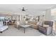 Spacious open-concept living room featuring modern furnishings and views of the kitchen and dining areas at 3805 S Ocean Blvd. # 503, North Myrtle Beach, SC 29582