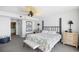 Calm main bedroom featuring a ceiling fan and views of the en suite bathroom at 3805 S Ocean Blvd. # 503, North Myrtle Beach, SC 29582