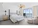 Comfortable main bedroom with a private balcony offering stunning ocean views at 3805 S Ocean Blvd. # 503, North Myrtle Beach, SC 29582