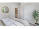 Bright bedroom with a round mirror and view to the hallway at 390 Acosta Circle, Conway, SC 29527