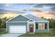 Charming single-story home with a neatly landscaped front yard and attached garage at 398 Acosta Circle, Conway, SC 29527