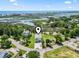 Aerial view of a stilt house near a waterway, showcasing its scenic surroundings and coastal location at 400 Elizabeth Dr., Murrells Inlet, SC 29576