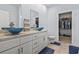 Elegant bathroom featuring a double bowl vanity with blue glass vessel sinks and granite countertops at 400 Elizabeth Dr., Murrells Inlet, SC 29576