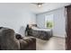 Cozy bedroom with a comfortable armchair, wooden floors and plenty of natural light at 400 Elizabeth Dr., Murrells Inlet, SC 29576