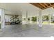 Covered parking with a green golf cart and convenient stair access to the home at 400 Elizabeth Dr., Murrells Inlet, SC 29576