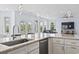 Open concept kitchen featuring a large island, stainless steel appliances, and views of the backyard and living area at 400 Elizabeth Dr., Murrells Inlet, SC 29576