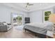Inviting main bedroom with a tray ceiling, balcony access, and hardwood floors at 400 Elizabeth Dr., Murrells Inlet, SC 29576