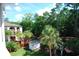 Beautiful wooded community view from a balcony featuring lush greenery, palm trees, and community shed at 400 Lands End Blvd. # 5304, Myrtle Beach, SC 29572